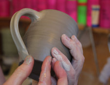 flipping the handle over and attaching the lower end